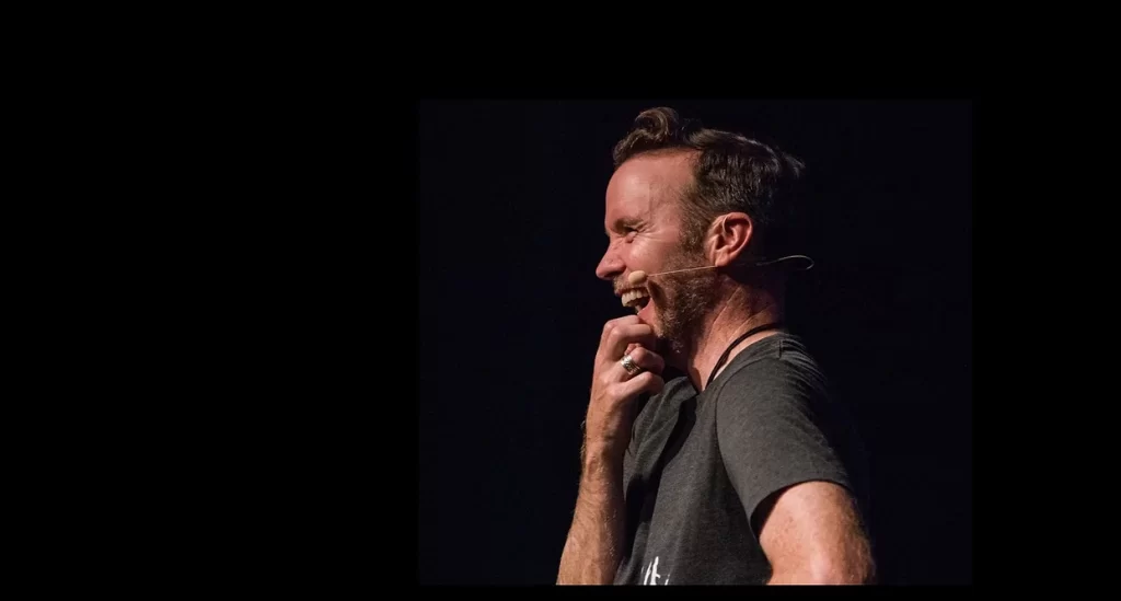 Image of Dermot Whelan Laughing While on Stage used on meditate with me page
